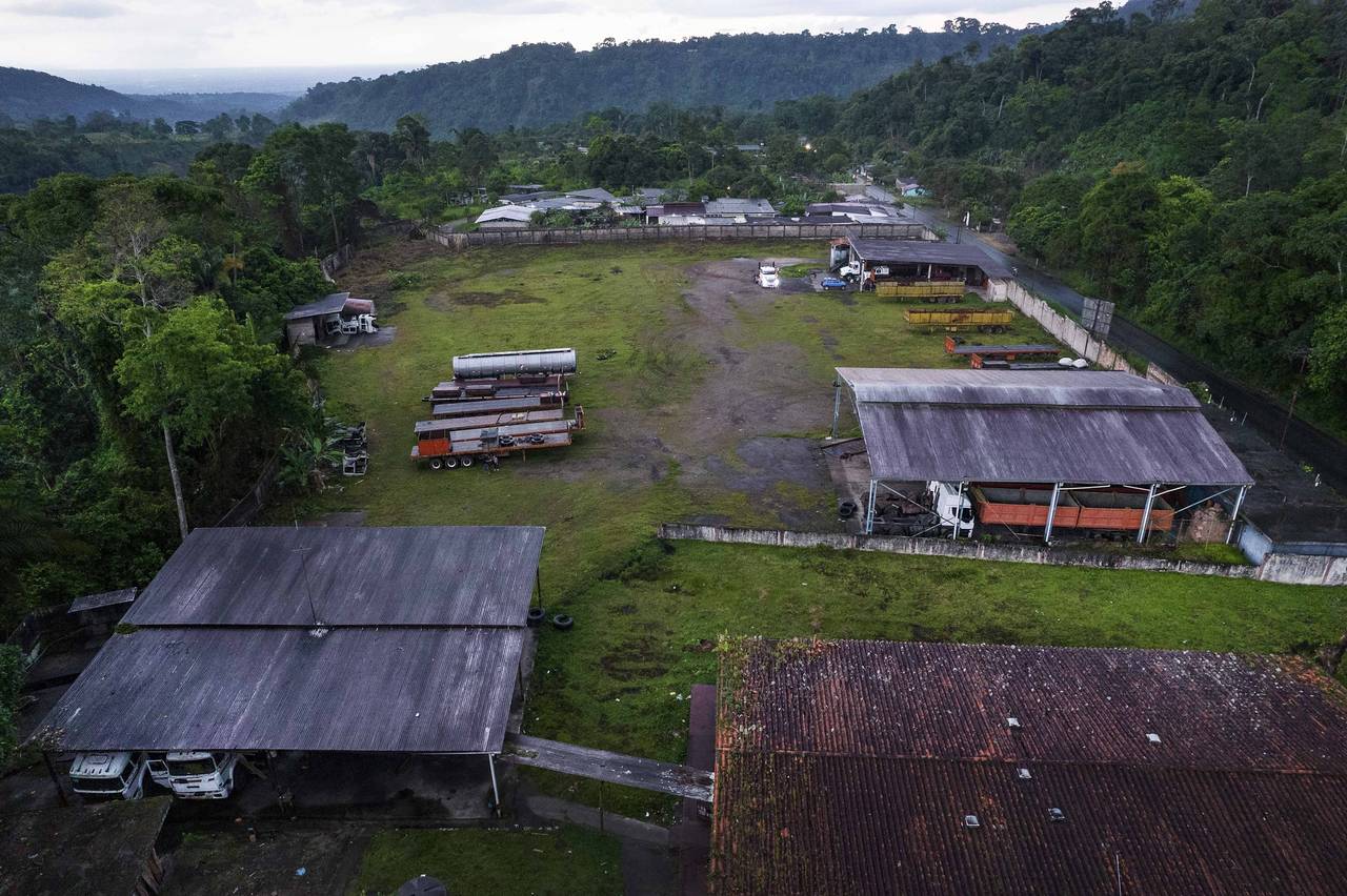 Disused trailers once used for moving Colombian coal sit pared on the property of veteran businessm...