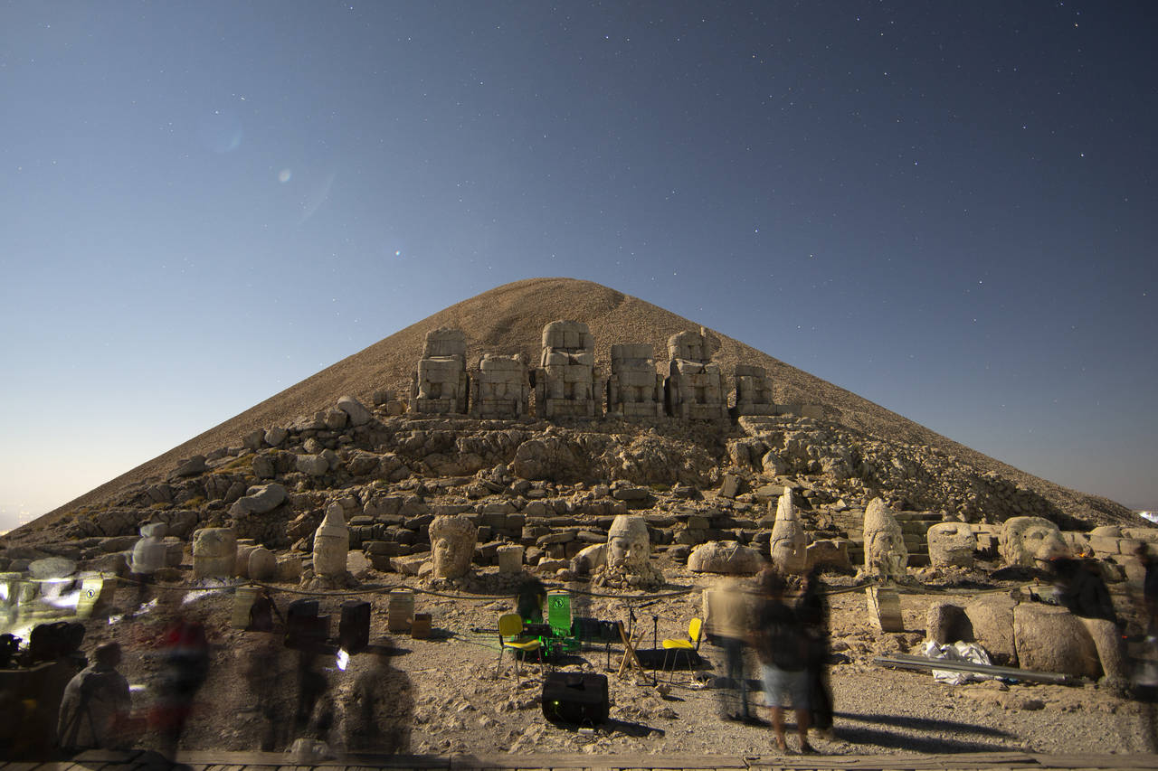 Stargazers gather to watch the Perseid meteor shower among ancient statues atop Mount Nemrut in sou...