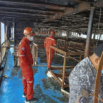 
              In this handout photo provided by the Philippine Coast Guard, Coast guard personnel inspect the aftermath of fire on board M/V Asia Philippines, an inter-island cargo and passenger vessel, near the Batangas port, southern Philippines on Saturday Aug. 27, 2022. Philippine coast guard personnel and volunteers have rescued more than 80 passengers and crew of an inter-island ferry that caught fire as it approached a port south of Manila, prompting many to jump into the water as flames spread fast in windy weather, officials said Saturday. (Philippine Coast Guard via AP)
            