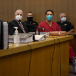 
              Scott Peterson, foreground right, sits with his attorneys, Andras Farkas, left, and Pat Harris, second from left, at the San Mateo County Superior Court in Redwood City, Calif., Thursday, Aug. 11, 2022. Peterson is in court for a hearing to determine whether he gets a new trial in the murder of his pregnant wife because of juror misconduct. (AP Photo/Jeff Chiu, Pool)
            