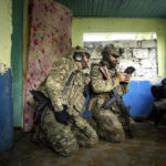 
              Ukrainian servicemen of "Fireflies" reconnaissance team operate a drone at their position at the frontline in Mykolaiv region, Ukraine, on Monday, Aug. 8, 2022. (AP Photo/Evgeniy Maloletka)
            