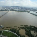 
              The Han River, swollen with floodwater, flows under bridges in Seoul, South Korea, Wednesday, Aug. 10, 2022. Cleanup and recovery efforts gained pace in South Korea's greater capital region Wednesday as skies cleared after two days of record-breaking rainfall that unleashed flash floods, damaged thousands of buildings and roads and killed multiple people. (AP Photo/Ahn Young-joon)
            