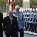 
              Turkey's President Recep Tayyip Erdogan, left, and Palestinian President Mahmoud Abbas review a military honour guard during a welcome ceremony in Ankara, Turkey, Tuesday, Aug. 23, 2022. Abbas is in Turkey for a two-day state visit. (AP Photo/Burhan Ozbilici)
            