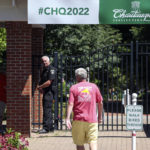 
              An officer stands outside a gate of the Chautauqua Institution in Chautauqua, N.Y., Friday, Aug. 12, 2022. Salman Rushdie, the author whose writing led to death threats from Iran in the 1980s, was attacked and apparently stabbed in the neck Friday by a man who rushed the stage as he was about to give a lecture at the Chautauqua Institution. (AP Photo/Joshua Bessex)
            