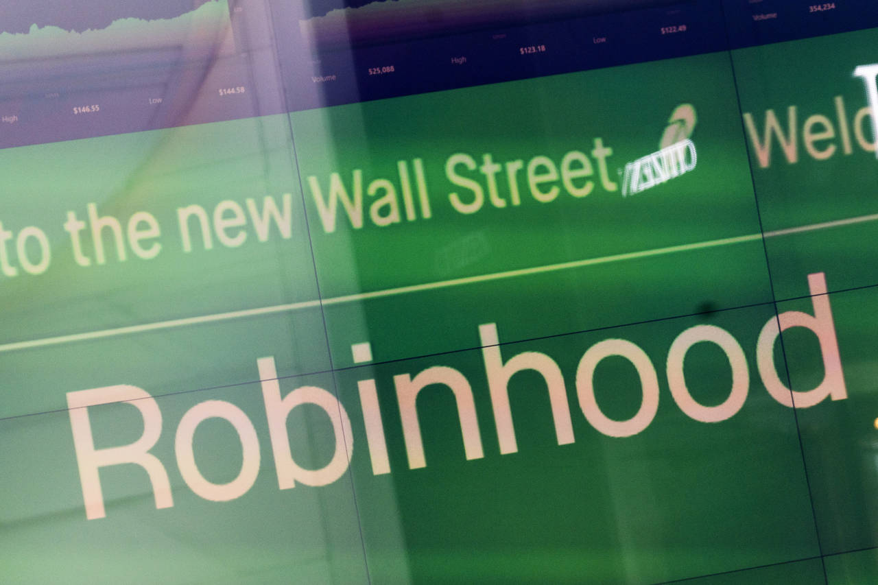 FILE - An electronic screen at Nasdaq displays Robinhood in New York's Times Square following the c...