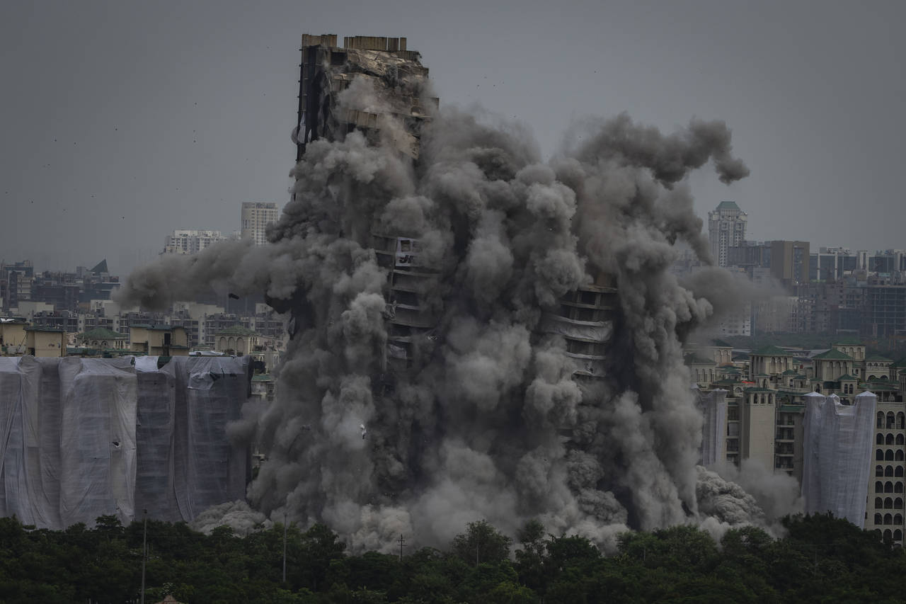 Cloud of dust rises as twin high-rise apartment towers are razed to ground in Noida, outskirts of N...