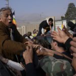 
              Former Army Maj. Antauro Humala, the brother of former President Ollanta Humala, greets supporters after he was released from prison, on the outskirts of Lima, Peru, Saturday, Aug. 20, 2022. Humala was serving a 19-year sentence for rebellion after taking up arms in 2005 against then-President Alejandro Toledo as well crimes of simple homicide, kidnapping, aggravated damage, theft, and firearm snatching. (AP Photo/Martin Mejia)
            