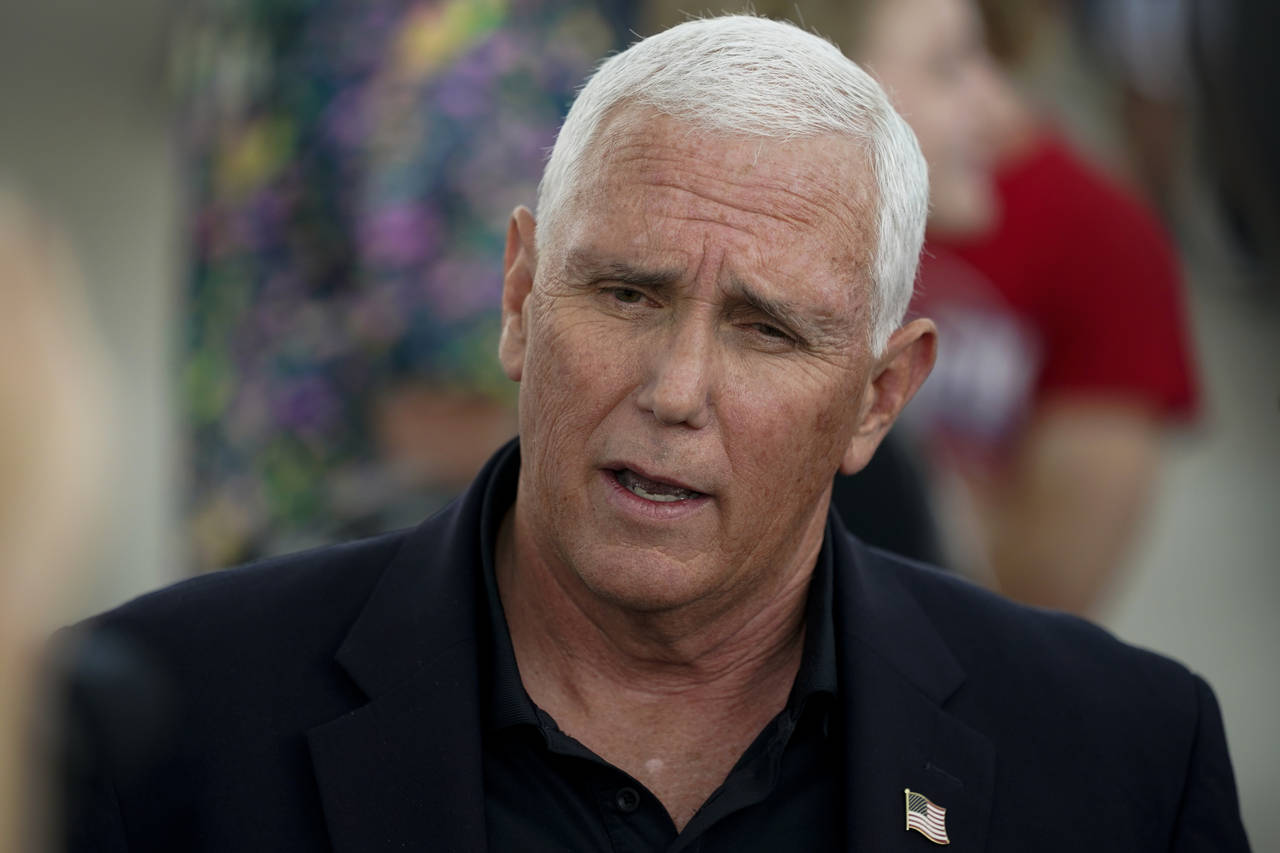Former Vice President Mike Pence speaks to reporters during a visit to the Iowa State Fair, Friday,...
