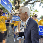 
              U.S. Rep Charlie Crist, D-Fla., pumps his fist as he walks past supporters before voting Tuesday, Aug. 23, 2022, in St. Petersburg, Fla. Crist is running for Florida Governor against Agriculture Commissioner Nikki Fried in the primary election. (AP Photo/Chris O'Meara)
            