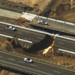 
              In this aerial image from video provided by Fox 11 Los Angeles is a washed out section of Interstate 10 near Desert Center, Calif., Thursday, Aug. 25, 2022. Officials say the main highway from Los Angeles to Phoenix has been damaged by a flash flood that washed out lanes on the eastbound side of Interstate 10 in the Southern California desert near the Arizona state line. Heavy rain from monsoonal thunderstorms Wednesday evening caused the latest round of flooding and also impacted other desert highways. (Fox 11 Los Angeles via AP)
            