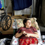 
              Melody Barnett rests at an American Red Cross shelter for McKinney Fire evacuees in Weed, Calif., on Monday, Aug. 1, 2022. She is waiting to return home to Yreka. (AP Photo/Noah Berger)
            