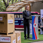 
              Boxes of medical equipment marked with USAID labels are visible next to Secretary of State Antony Blinken as he speaks at a COVID-19 assistance event outside a COVID-19 vaccination clinic at the Manila Zoo in Manila, Philippines, Saturday, Aug. 6, 2022. Blinken is on a ten-day trip to Cambodia, Philippines, South Africa, Congo, and Rwanda. Also pictured is U.S. Ambassador to the Philippines MaryKay Carlson, right. (AP Photo/Andrew Harnik, Pool)
            