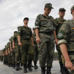 
              FILE - Russian army soldiers march during an action in support for the soldiers involved in the military operation in Ukraine, at the Mamaev Kurgan, a World War II memorial in Volgograd, Russia, July 11, 2022. Russian President Vladimir Putin has on Thursday, Aug. 25 ordered the Russian military to increase the size of the country's armed forces by 137,000 amid Moscow’s military action in Ukraine. (AP Photo/Alexandr Kulikov, file)
            