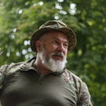 
              Col. Yurii Bereza with the Dnipro-1 regiment is photographed at the unit's headquarters during a period of relative calm near Sloviansk, Donetsk region, eastern Ukraine, Friday, Aug. 5, 2022. "I think it won't be calm for long. Eventually there will be an assault," Col. Bereza told the Associated Press on Friday, adding that he expected the area to get "hot" in the coming days. (AP Photo/David Goldman)
            