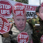 
              Protesters wearing masks of U.S. President Joe Biden, left, and South Korean President Yoon Suk Yeol stage a rally to oppose planned joint military exercises, called the Ulchi Freedom Shield, between South Korea and the United States on the occasion of U.S. House of Representatives Speaker Nancy Pelosi's visit in South Korea, in front of the presidential office in Seoul, South Korea, Thursday, Aug. 4, 2022. The banner reads, "Stop the Ulchi Freedom Shield." (AP Photo/Ahn Young-joon)
            