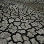 
              FILE - Dry, cracked land is visible in The Boca reservoir that supplies water to the northern city of Monterrey during a drought in Santiago, Mexico, July 9, 2022. Climate hazards such as flooding, heat waves and drought have worsened more than half of the hundreds of known infectious diseases in people, such as malaria, hantavirus, cholera and even anthrax, according to a new study released Monday, Aug. 8. (AP Photo/Fernando Llano, File)
            