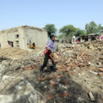 
              A family collects items from the remains of their home damaged by flooding after heavy rains in the Shikarpur district of Sindh province, Pakistan, Tuesday, Aug. 30, 2022. Disaster officials say nearly a half million people in Pakistan are crowded into camps after losing their homes in widespread flooding caused by unprecedented monsoon rains in recent weeks. (AP Photo/Fareed Khan)
            