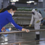 
              FILE - In this photo published on June 28, 2022 by the North Korean government, North Korean employees disinfect a facility at an underground store in Pyongyang, North Korea. Independent journalists were not given access to cover the event depicted in this image distributed by the North Korean government. The content of this image is as provided and cannot be independently verified. Korean language watermark on image as provided by source reads: "KCNA" which is the abbreviation for Korean Central News Agency. North Korea on Thursday, Aug. 25, 2022, said it found four new fever cases in its border region with China that may have been caused by coronavirus infections, two weeks after leader Kim Jong Un declared a widely disputed victory over COVID-19. (Korean Central News Agency/Korea News Service via AP, File)
            