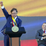 
              President Gustavo Petro raises his fist at the end of his inauguration speech in Bogota, Colombia, Sunday, Aug. 7, 2022. (AP Photo/Fernando Vergara)
            