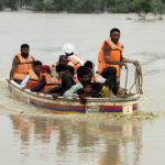 
              Army troops evacuate people from a flood-hit area in Rajanpur, district of Punjab, Pakistan, Saturday, Aug. 27, 2022. Officials say flash floods triggered by heavy monsoon rains across much of Pakistan have killed nearly 1,000 people and displaced thousands more since mid-June. (AP Photo/Asim Tanveer)
            