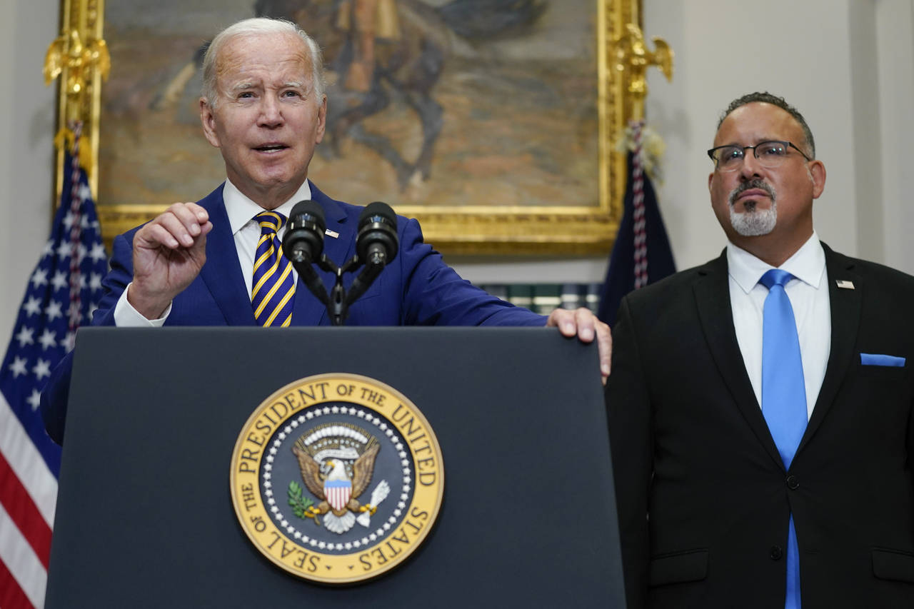 President Joe Biden speaks about student loan debt forgiveness in the Roosevelt Room of the White H...