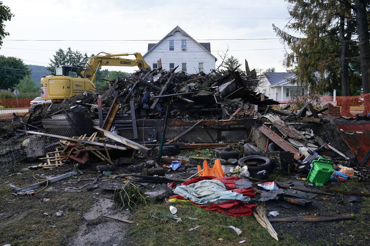 A house that was destroyed by a fatal fire is viewed in Nescopeck, Pa., Friday, Aug. 5, 2022. Multi...