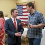 
              FILE - In this May 13, 2022, photo, GOP candidate for attorney general Doug Wardlow, left, speaks with a person during the first day of the Minnesota State Republican Convention at the Mayo Civic Center in. Rochester, Minn. (Glen Stubbe/Star Tribune via AP, file)
            