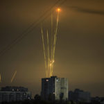 
              Russian rockets launch against Ukraine from Russia's Belgorod region are seen at dawn in Kharkiv, Ukraine, early Saturday, Aug. 20, 2022. (AP Photo/Vadim Belikov)
            