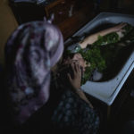 
              Millaray Huichalaf, a Mapuche machi, or healer and spiritual guide, bathes a woman suffering from pneumonia with native plants as part of a medicinal practice known as lawen at her home in Carimallin, southern Chile, on Sunday, June 26, 2022. Huichalaf became seriously ill as a child in the nearby city of Osorno until her family realized it was an ancestor's spirit wanting to come back in her as a healer. (AP Photo/Rodrigo Abd)
            