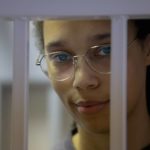 
              WNBA star and two-time Olympic gold medalist Brittney Griner stands in a cage in a courtroom prior to a hearing in Khimki just outside Moscow, Russia, Thursday, Aug. 4, 2022. Closing arguments in Brittney Griner's cannabis possession case are set for Thursday, nearly six months after the American basketball star was arrested at a Moscow airport in a case that reached the highest levels of US-Russia diplomacy. (Evgenia Novozhenina/Pool Photo via AP)
            