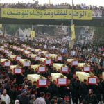 
              FILE - Thousands of Muslim mourners crowd as the coffins of 64 Hezbollah guerrillas are carried to a cemetery in a suburb of Beirut, July 23, 1996. Forty years since it was founded, Lebanon's Hezbollah has transformed from a ragtag organization to the largest and most heavily armed militant group in the Middle East. (AP Photo/Ali Mohamed, File)
            
