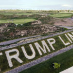 
              FILE - Patrons play the links as a giant branding sign is displayed with flagstones at Trump Golf Links, at Ferry Point in the Bronx borough of New York, May 4, 2021. A New York City-owned golf course managed by former President Donald Trump's business is expected to host a Saudi Arabia-supported women's tournament in October, city officials said Friday, Aug. 26, 2022. (AP Photo/John Minchillo, File)
            