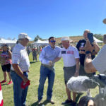 
              Republican Nevada Senate candidate Adam Laxalt, center left, takes pictures with supporters at the seventh annual Basque Fry at the Corley Ranch on Saturday, Aug. 13, 2022, outside Gardnerville, Nev. (AP Photo/Gabe Stern)
            