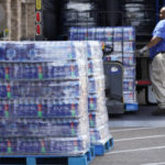 
              Pallets loaded with cases of water are unloaded at a Kroger grocery store in north Jackson, Miss., Tuesday, Aug. 30, 2022. The grocery chain and other stores are facing the challenges of the city's longstanding water system problems, by making more drinking water available for its customers. Recent flooding worsened problems in one of two water-treatment plants and the state Health Department has had Mississippi's capital city under a boil-water notice since late July. (AP Photo/Rogelio V. Solis)
            