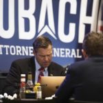 
              Kansas Attorney General candidate Kris Kobach hosts his watch party at the Celtic Fox Irish Pub and Restaurant in Topeka, Kan., Tuesday, Aug. 2, 2022. (Chance Parker/The Topeka Capital-Journal via AP)
            