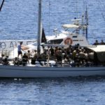 
              A sailboat carrying migrants is escorted by the coast guard in Kapsali port on the southern island of Kythera, Greece, on Wednesday, Aug. 17, 2022. The boat was the second to arrive on the island on Wednesday, after another sailboat ran aground in the early hours of the morning with 97 people on board. (Giorgos Samios/kythera.news via AP)
            