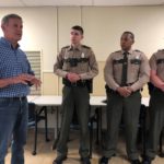 
              Tennessee Gov. Bill Lee, left, speaks with Tennessee Highway Patrol troopers on Thursday, Aug. 4, 2022, in Memphis, Tenn. Lee rode with troopers on Interstate 240 as part of a trip to Memphis that also included meetings with business leaders and a visit to a non-profit organization that works with children. Lee is running unopposed in the Republican primary election on Thursday as he seeks a second term as Tennessee governor. (AP Photo/Adrian Sainz)
            