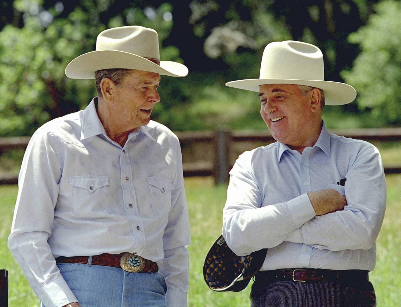 FILE - Former President Ronald Reagan, left, and former Soviet President Mikhail Gorbachev don cowb...
