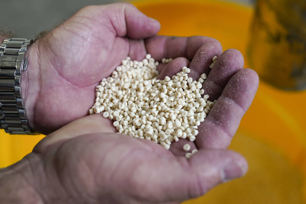 Kevin Welsh holds up PHA pellets at the Danimer Scientific plant on Wednesday, Aug. 3, 2022 in Winc...