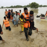 
              Army troops evacuate people from a flood-hit area in Rajanpur, district of Punjab, Pakistan, Saturday, Aug. 27, 2022. Officials say flash floods triggered by heavy monsoon rains across much of Pakistan have killed nearly 1,000 people and displaced thousands more since mid-June. (AP Photo/Asim Tanveer)
            