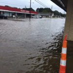 
              In this photo provided by Pastor Bryant May, rain water covered Bierdeman Road in Pearl, Miss., Wednesday, Ag. 24, 2022. Several buildings on the street were flooded, including an outlet store and a church. (Pastor Bryant May via AP)
            