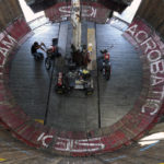 
              Zoran Milojkovic prepares a motorcycle in the "Wall of Death", also known as a motordrome or silodrome, prior the motorcycle rally in Belgrade, Serbia, Thursday, Aug. 18, 2022. Motorcycle enthusiasts in Belgrade were in for a trip down the memory lane last week when near-forgotten Well of Death stunt show came to town (AP Photo/Darko Vojinovic)
            