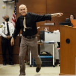 
              Steven Schusler demonstrates in court how Marjory Stoneman Douglas High School shooter Nikolas Cruz ran down the street in an uncoordinated fashion with what Schusler alternately described as "an Airsoft gun" or "an air rifle" during an incident in front of their Parkland homes in Cruz's adolescence. This while Schusler testified in the penalty phase of Cruz's trial at the Broward County Courthouse in Fort Lauderdale on Wednesday, Aug. 24, 2022. Schusler lived across the street from the Cruz family for 6 years when Cruz was approximately 10-16 years old. Cruz previously plead guilty to all 17 counts of premeditated murder and 17 counts of attempted murder in the 2018 shootings. (Amy Beth Bennett/South Florida Sun Sentinel via AP, Pool)
            