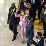 
              This handout photo taken and released by Malaysia’s Department of Information, U.S. House Speaker Nancy Pelosi, center, waves to media as she tours the parliament house in Kuala Lumpur, Tuesday, Aug. 2, 2022. Pelosi arrived in Malaysia on Tuesday for the second leg of an Asian tour that has been clouded by an expected stop in Taiwan, which would escalate tensions with Beijing. (Malaysia’s Department of Information via AP)
            