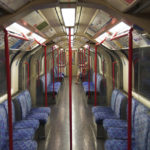 
              One person sits on a Central Line train in London, Friday Aug. 19, 2022. Tube, rail and bus services are set to be severely disrupted in the capital as members of Unite and the Rail, Maritime and Transport (RMT) union strike in a continuing row over pay, jobs and conditions. (Stefan Rousseau/PA via AP)
            