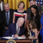 
              President Joe Biden signs the "PACT Act of 2022" during a ceremony in the East Room of the White House, Wednesday, Aug. 10, 2022, in Washington. (AP Photo/Evan Vucci)
            