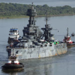
              The USS Texas is towed down the Houston Ship Channel, Wednesday, Aug. 31, 2022, in Baytown, Texas. The vessel, which was commissioned in 1914 and served in both World War I and World War II, is being towed to a dry dock in Galveston where it will undergo an extensive $35 million repair. (AP Photo/David J. Phillip)
            