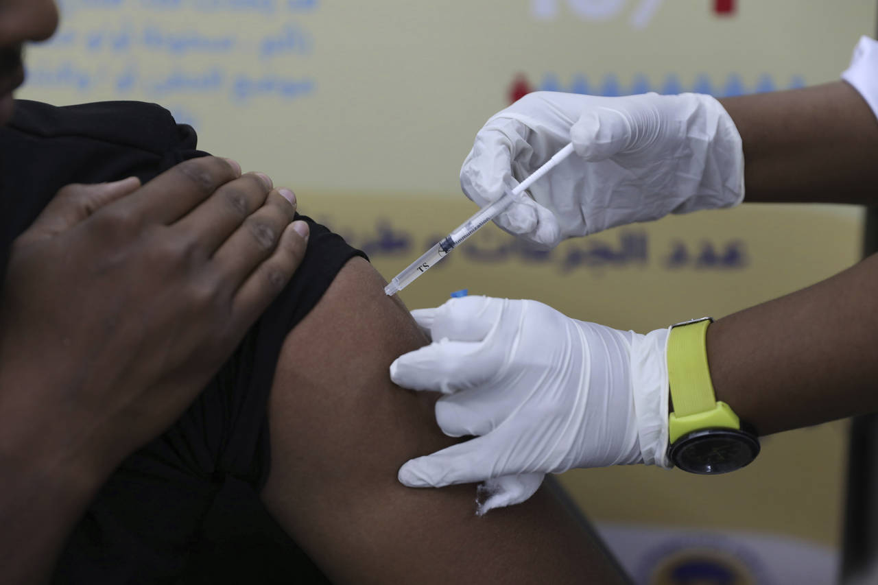 FILE - A man receives the AstraZeneca COVID-19 vaccine at Jabra Hospital in Khartoum, Sudan, Thursd...