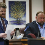 
              Mark Bankston, lawyer for Neil Heslin and Scarlett Lewis, asks Alex Jones questions about text messages during trial at the Travis County Courthouse in Austin, Wednesday Aug. 3, 2022. Jones testified Wednesday that he now understands it was irresponsible of him to declare the Sandy Hook Elementary School massacre a hoax and that he now believes it was “100% real." (Briana Sanchez/Austin American-Statesman via AP, Pool)
            