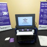 
              FILE - VotingWorks displays a precinct scanner with a voter-facing screen that collapses into a tamper-evident ballot box on wheels during the summer conference of the National Association of Secretaries of State in Baton Rouge, La., July 8, 2022. In 2018, the nation’s top homeland security and cybersecurity officials urged states to replace any remaining voting systems without a paper trail to improve security and increase public confidence. Congress allocated $805 million ahead of the 2020 election to help states pay for security upgrades, including new equipment. (AP Photo/Matthew Hinton, File)
            